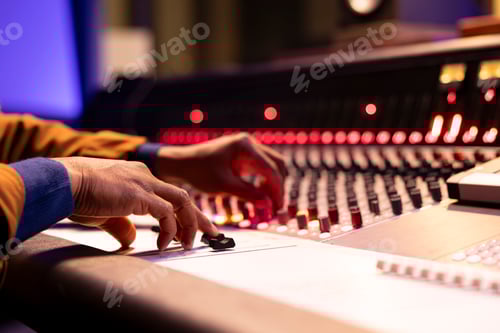 Preview: Music engineer using audio mixer and console in professional studio