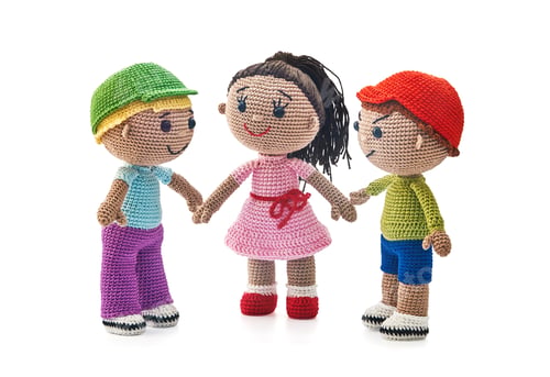 Preview: Knitted toys boys and girl on a white background