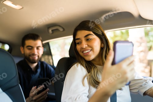Preview: Attractive driver working on a rideshare app