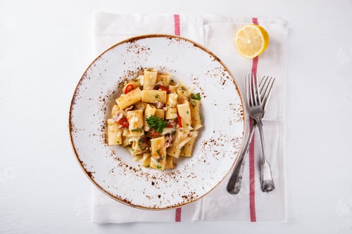 Preview: Pasta Dish with Lemon on White Surface