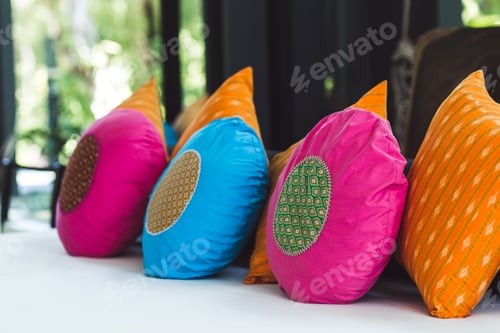 Preview: Multicolor round pillows on sofa