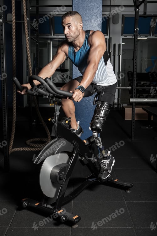 Preview: Sportive man with prosthesis leg riding bicycle
