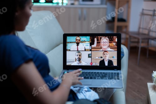 Preview: Lady having online meeting with partners