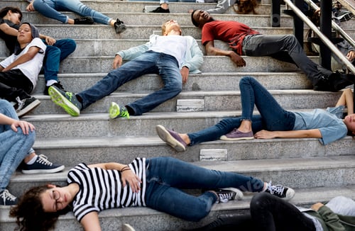 Preview: Young students sleeping on the staircase