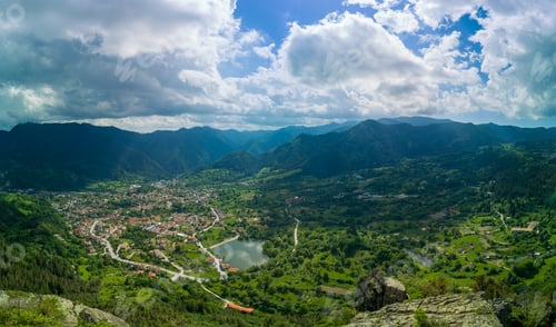 Preview: Bulgarian town Smolyan with lake, vegetation and clouds. Rhodope Mountains. Panorama, top view