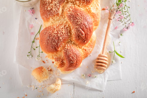 Preview: Homemade golden challah baked in a home bakery.