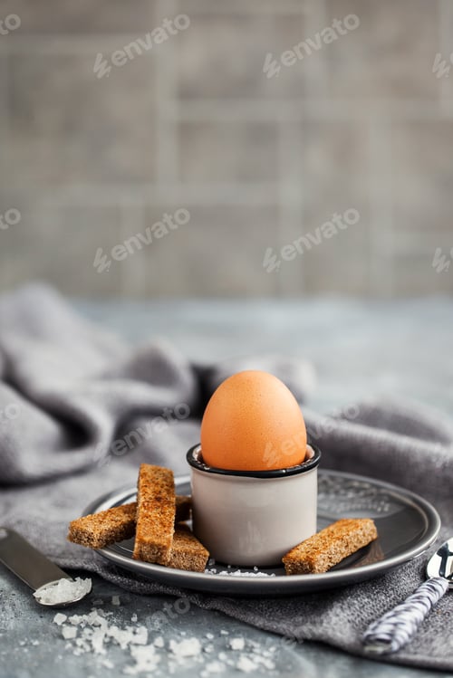 Preview: Boiled egg with rye toasts for breakfast