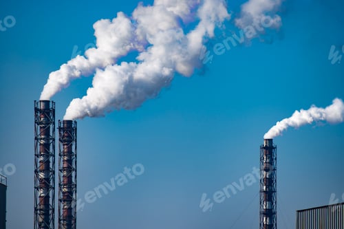 Preview: Smoke stack of coal power plant on blue sky background. Place for text