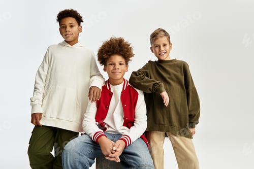 Preview: Adorable little boys showcase vibrant fashion while enjoying friendship and togetherness