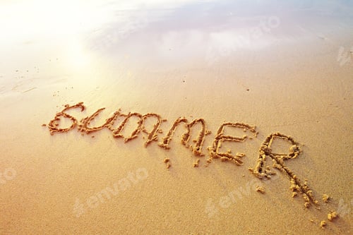 Preview: Summer letters handwritten in sand on beach