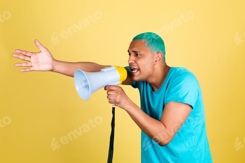 Preview: Black african man in casual on yellow background blue hair screaming shouting in megaphone to left