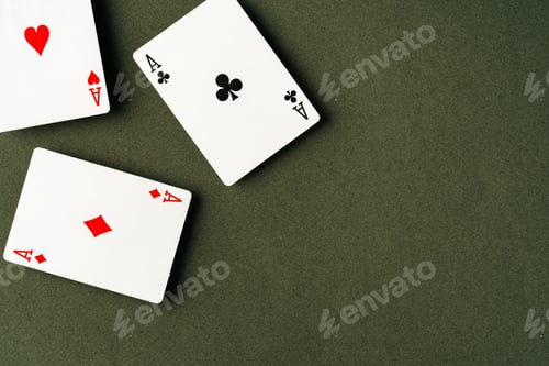 Preview: Playing cards on green background studio shot