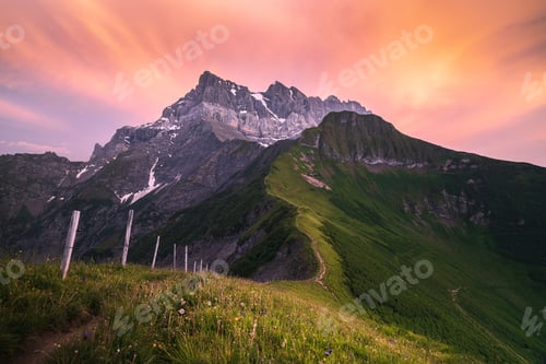 Preview: Summer sunset on a mountain ridge leading to the Dents du Midi range