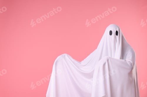 Preview: Creepy ghost. Man covered with white sheet on pink background. Space for text