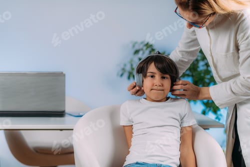 Preview: Boy Having Pure Tone Audiometry Test at Audiology Office.