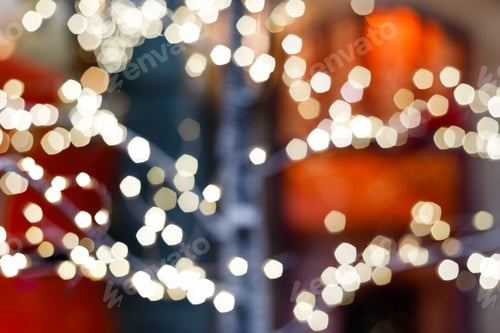 Preview: Close up of balls on christmas tree. Bokeh garlands in the background. New Year concept.
