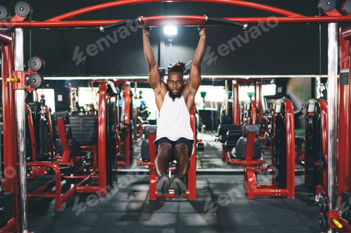 Preview: Black man doing pull ups in gym