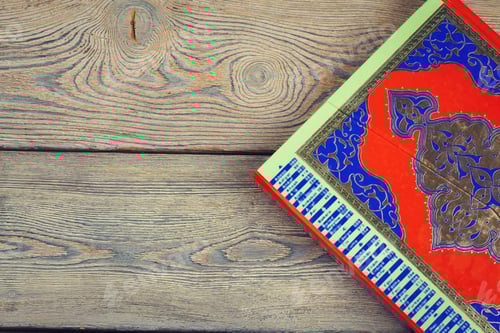 Preview: Koran holy book of Muslims, public item of all muslims on the table , still life