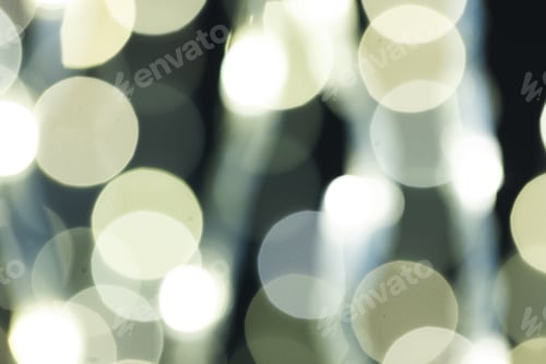 Preview: Multiple white bokeh lights with copy space on dark background