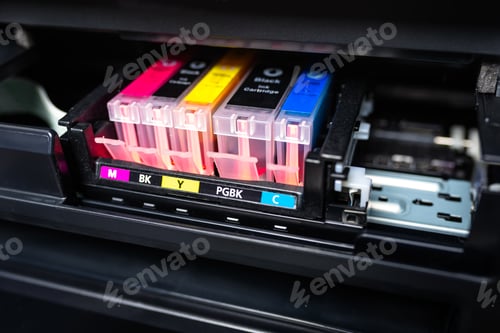 Preview: Close-up shot of a CMYK ink cartridges in a color printer.