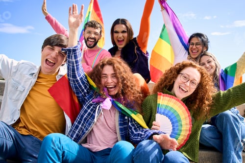 Preview: Different excited young friends group celebrating gay pride festival day together. People LGBT.