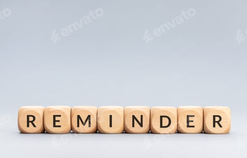 Preview: Reminder word on wooden blocks on gray background