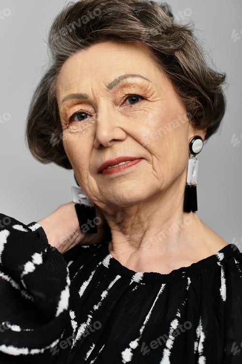 Preview: A graceful woman in her 60s showcases timeless elegance and style while posing.