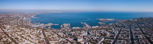 Preview: Panorama of the city of Odessa and the sea with a port against a blue sky on a sunny day. Aerial
