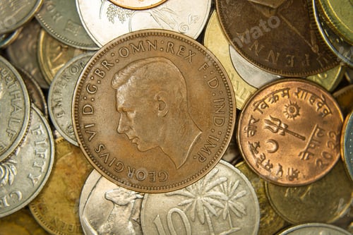 Preview: A heap of world coins closeup, grunge financial background