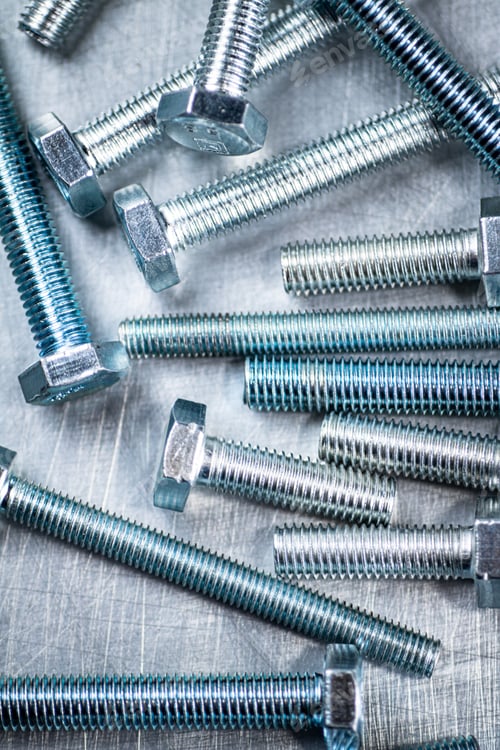 Preview: Working tool. Bolts on a gray background.