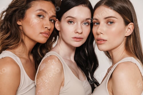 Preview: Multiracial three women hugging while posing together in underwear