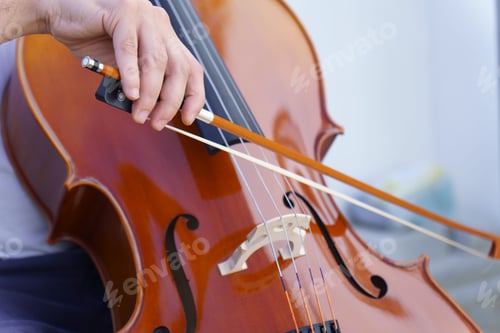 Preview: Close-up of a man's hands playing the cello
