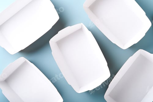 Preview: Kraft paper food containers or plate on blue background. Eco craft paper tableware. Recycling and fo