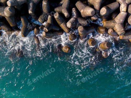 Preview: Aerial drone view of a breakwater. breakwater in the sea, a collection of concrete breakers