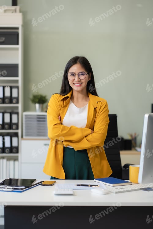 Preview: Happy young Asian woman presenting or showing open hand palm, happy working.