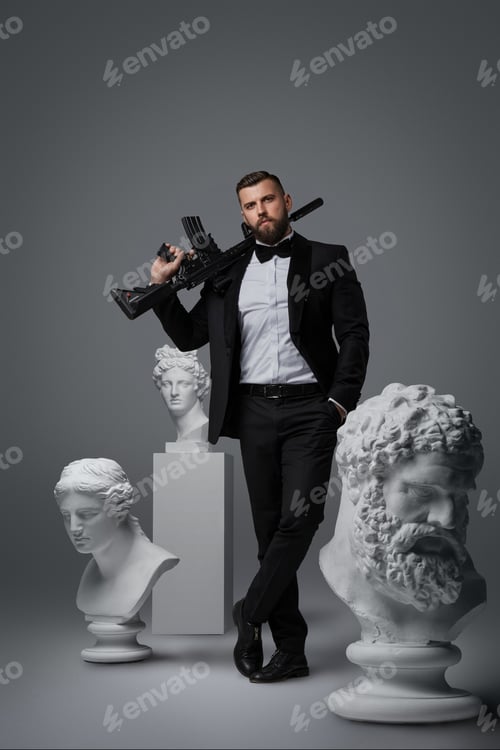 Preview: Stylish handsome man with beard wears a luxurious black suit and bowtie