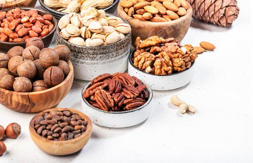 Preview: Almonds, hazelnuts, walnuts and other. Healthy food snack mix on white table, top view