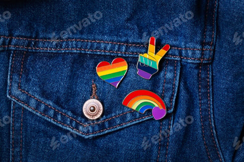 Preview: Rainbow lgbtq flag badges against denim background, pride month