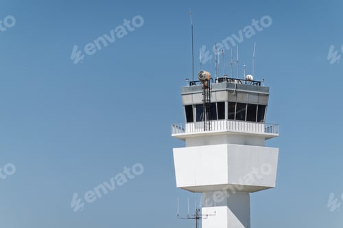 Preview: Modern Air Traffic Control Tower Against Clear Blue Sky