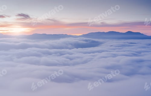Preview: Sunset Sky Clouds in the Morning with colorful Orange Sunrise over Mist or Sea Fog cover Mountain