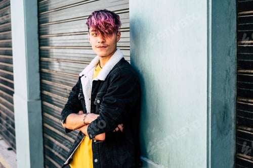Preview: Portrait of handsome and young teenager boy man with violet diversity alternative hair look style