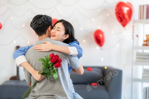Preview: Asian couple Showing love surprise giving flowers