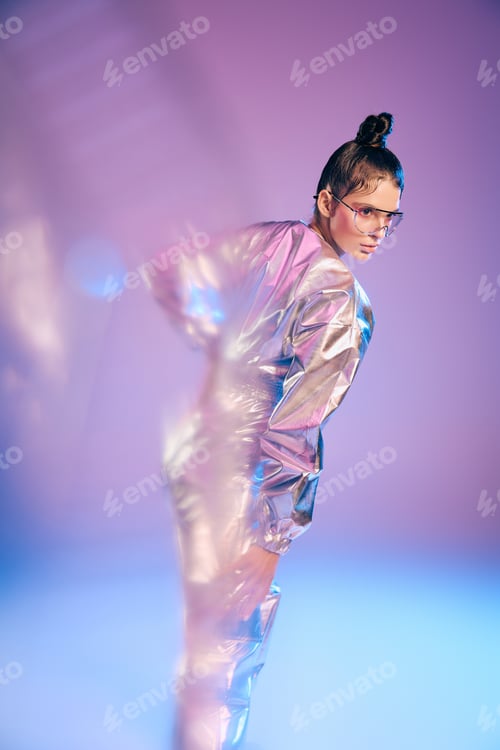 Preview: Stylish woman in holographic attire exudes vibrant energy in a futuristic setting