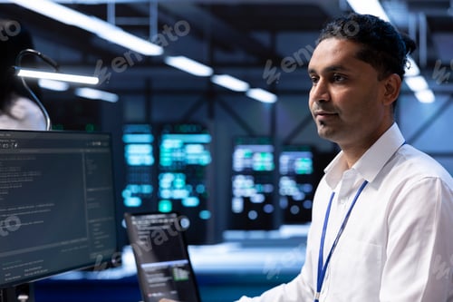 Preview: Specialist doing server racks maintenance using PC
