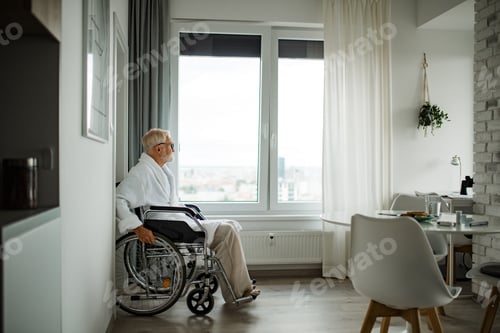 Preview: Senior man in a wheelchair spends time alone in his apartment.