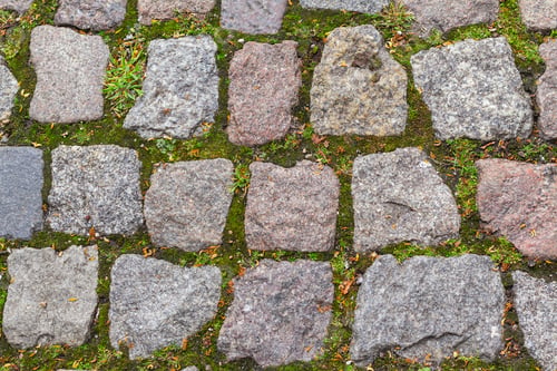 Preview: cobblestone pavement of old town texture background. Top view of stone road. Detail granite sidewalk