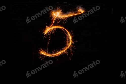Preview: The Number 5 Made Of Sparklers On Black Background