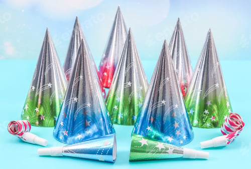 Preview: Set of cone hats and birthday whistles on a blue background.