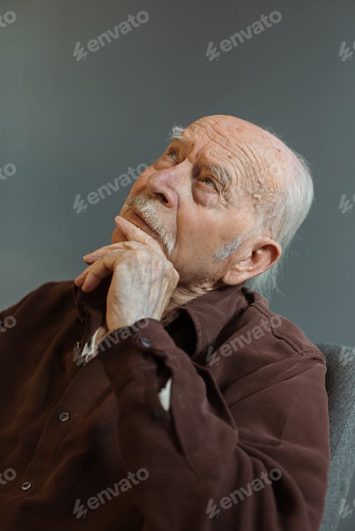 Preview: Close up. Thoughtful portrait of a gray-haired old man.