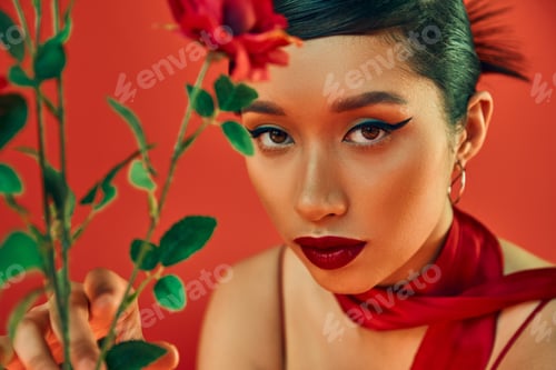 Preview: portrait of young asian woman in neckerchief,with bold makeup and expressive gaze